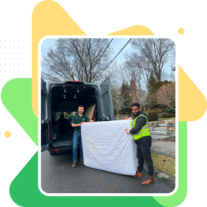 Grunber team, carefully loading a mattress into a grey van