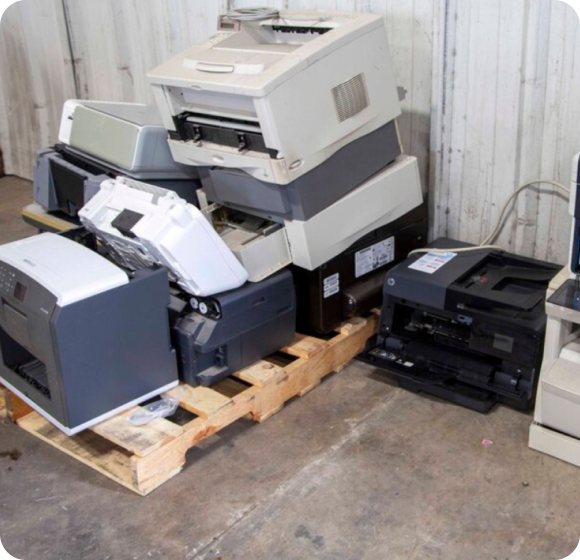 Several printers arranged on a wooden pallet