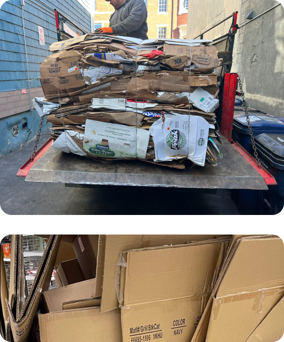 A Grunber team driver loading a cardboard bale onto their truck for recycling, Flattened cardboard boxes stacked loosely in a cart