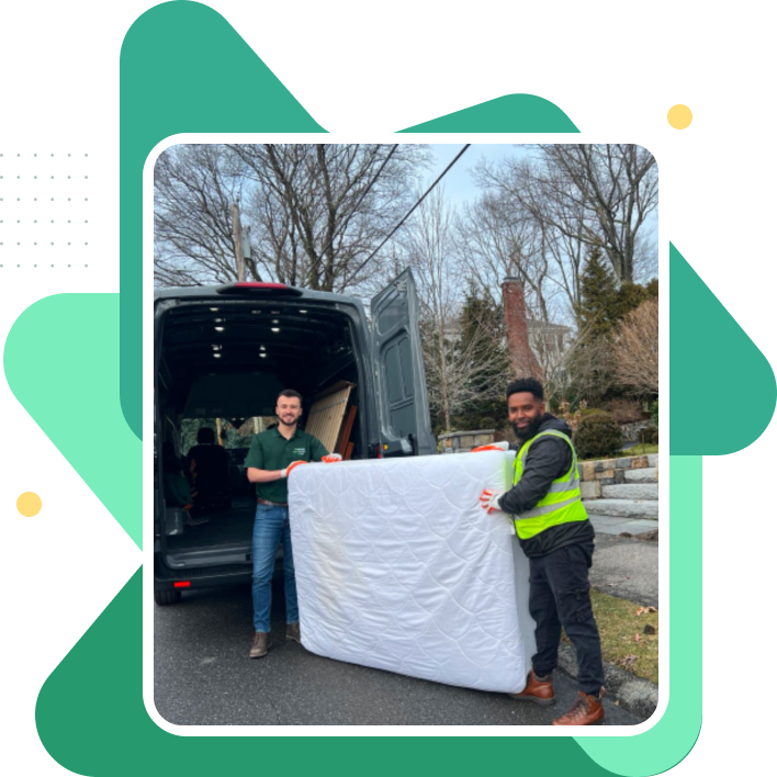 Grunber team loading an old Matrress item into the mattress removal truck