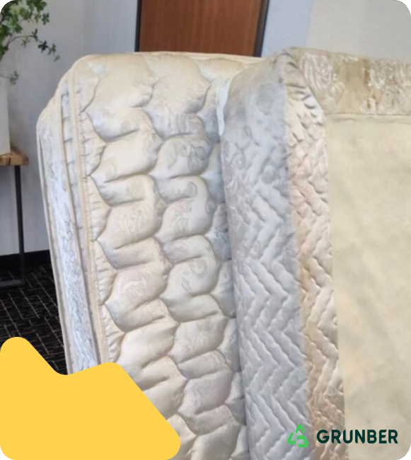 Box spring and mattress removal service provided by Grunber in a residential setting;